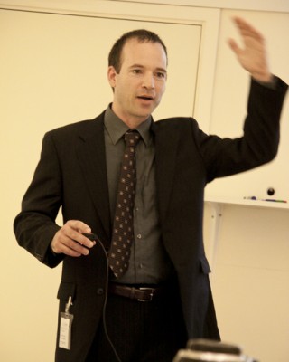 Jason Meggs presents to Members of Parliament in Stockholm, Sweden. Photo by Elin Bandman.